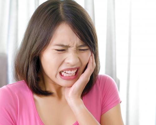 Woman experiencing toothache