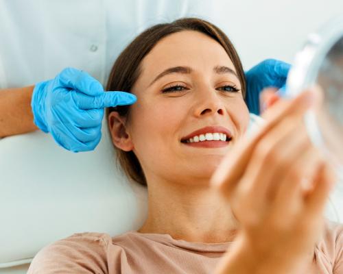 Examining wrinkles on woman's face